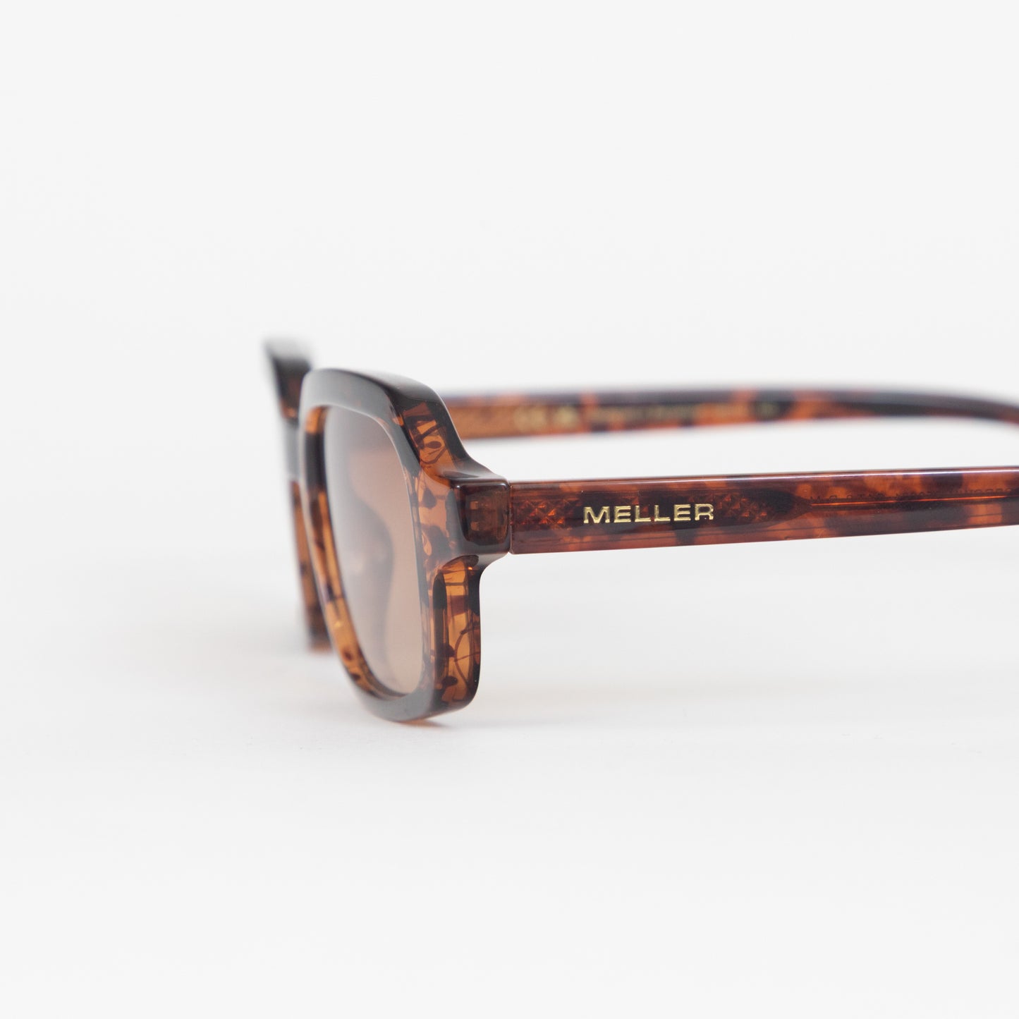 Meller sunglasses tortoiseshell frame and gold branding