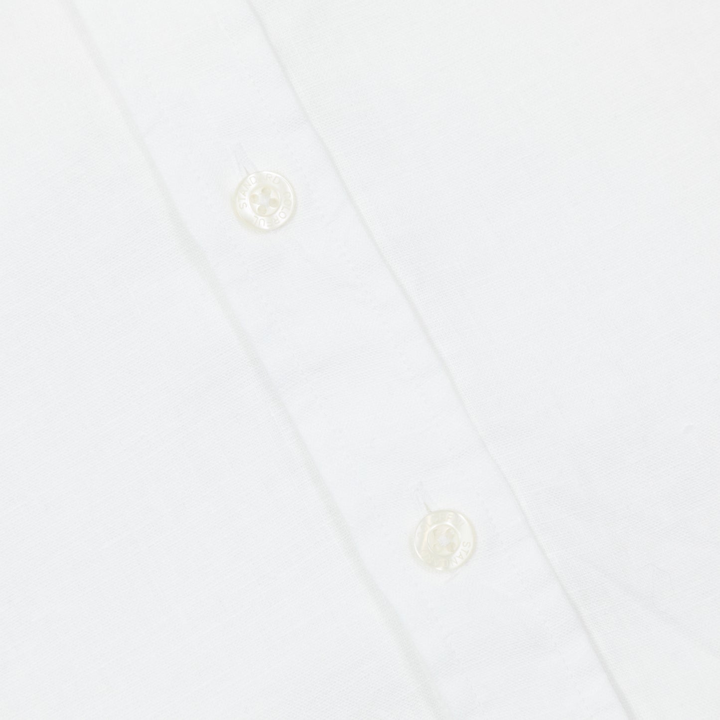 button up detail of colorful standard linen shirt