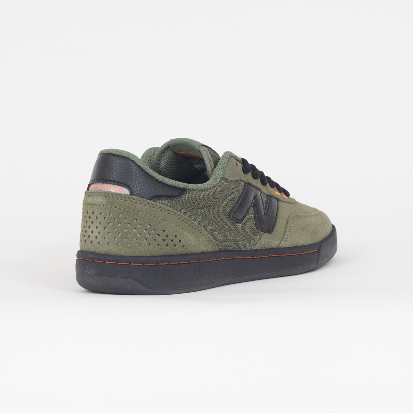 green new balance trainer with black gum and accents