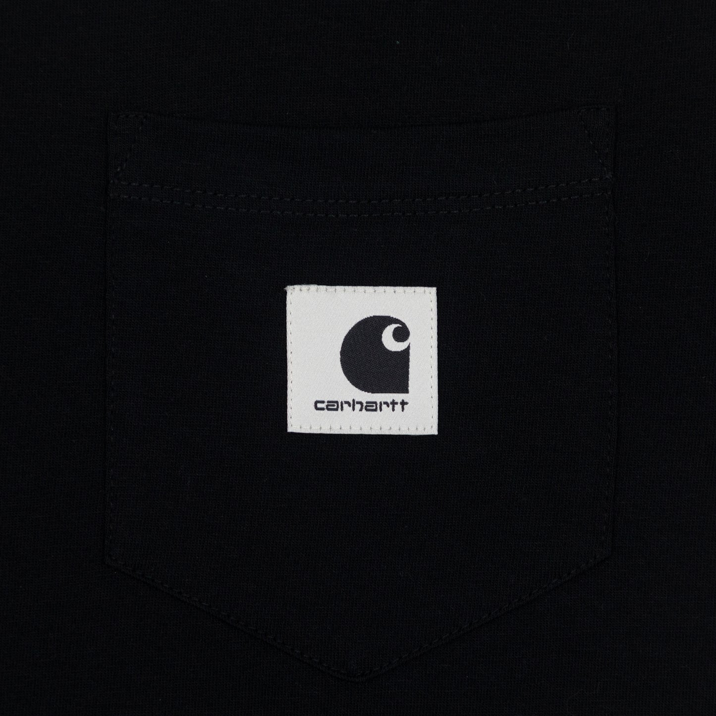 Close-up of a Carhartt logo on a black t-shirt