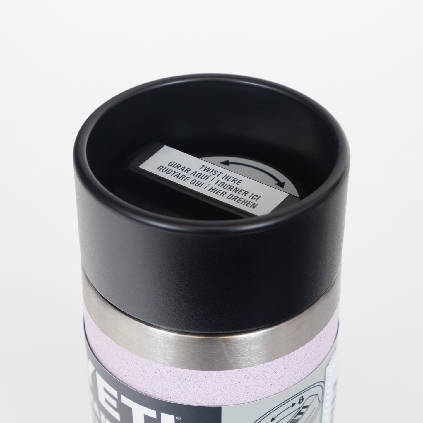 Close-up of a black lid on a Yeti mug with a white background