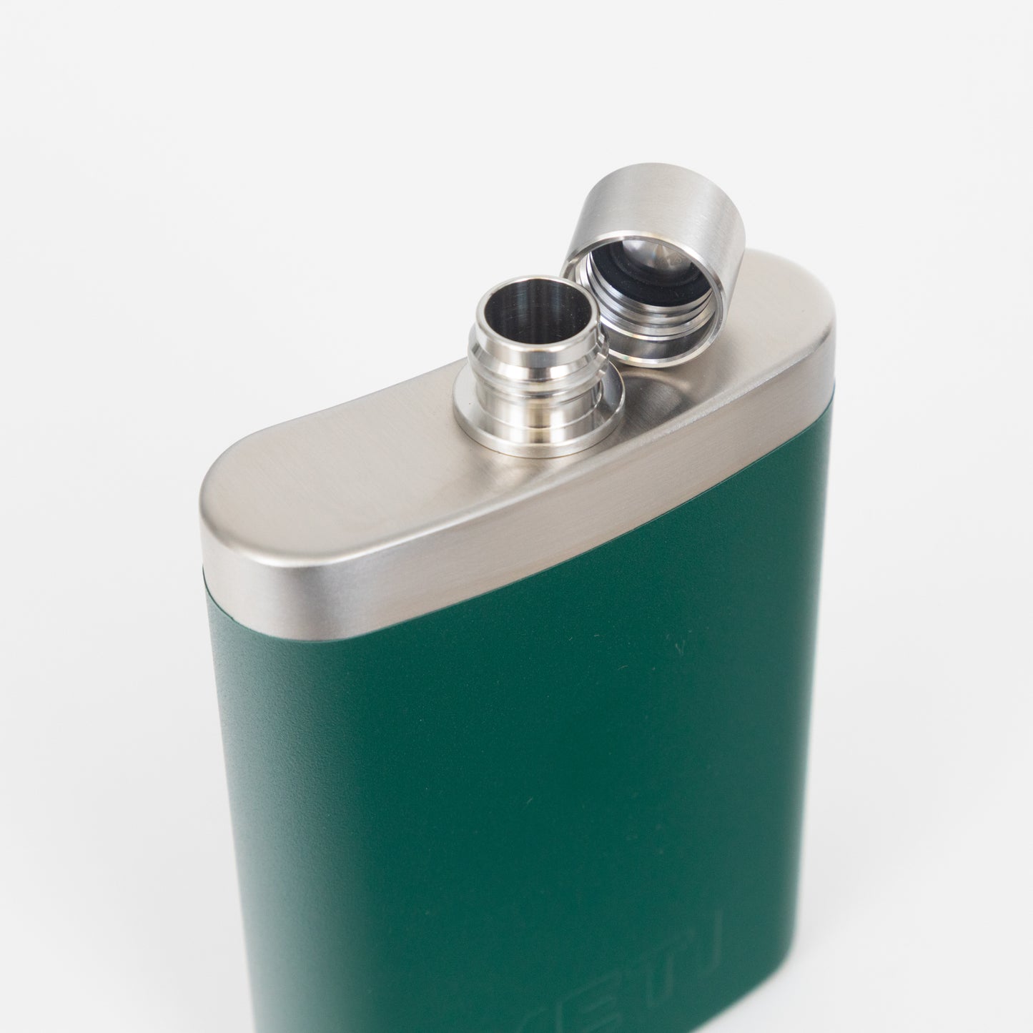 Green YETI flask screw lid off