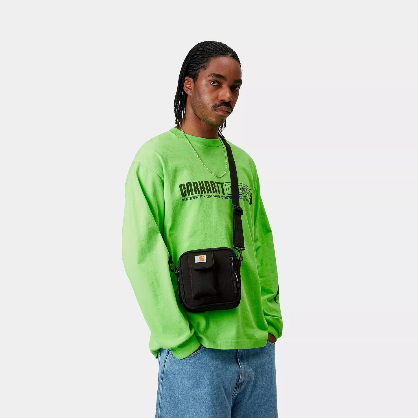 person wearing carhartt cross body bag black