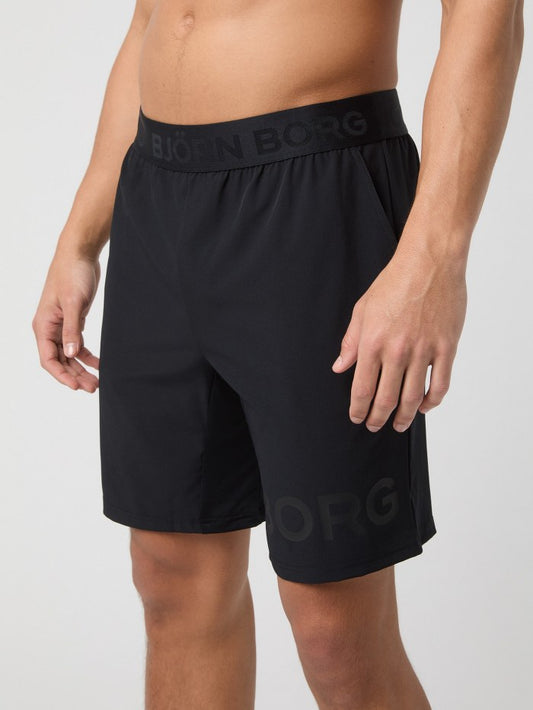 Black athletic shorts with 'Bjärn Borg' branding on a white background