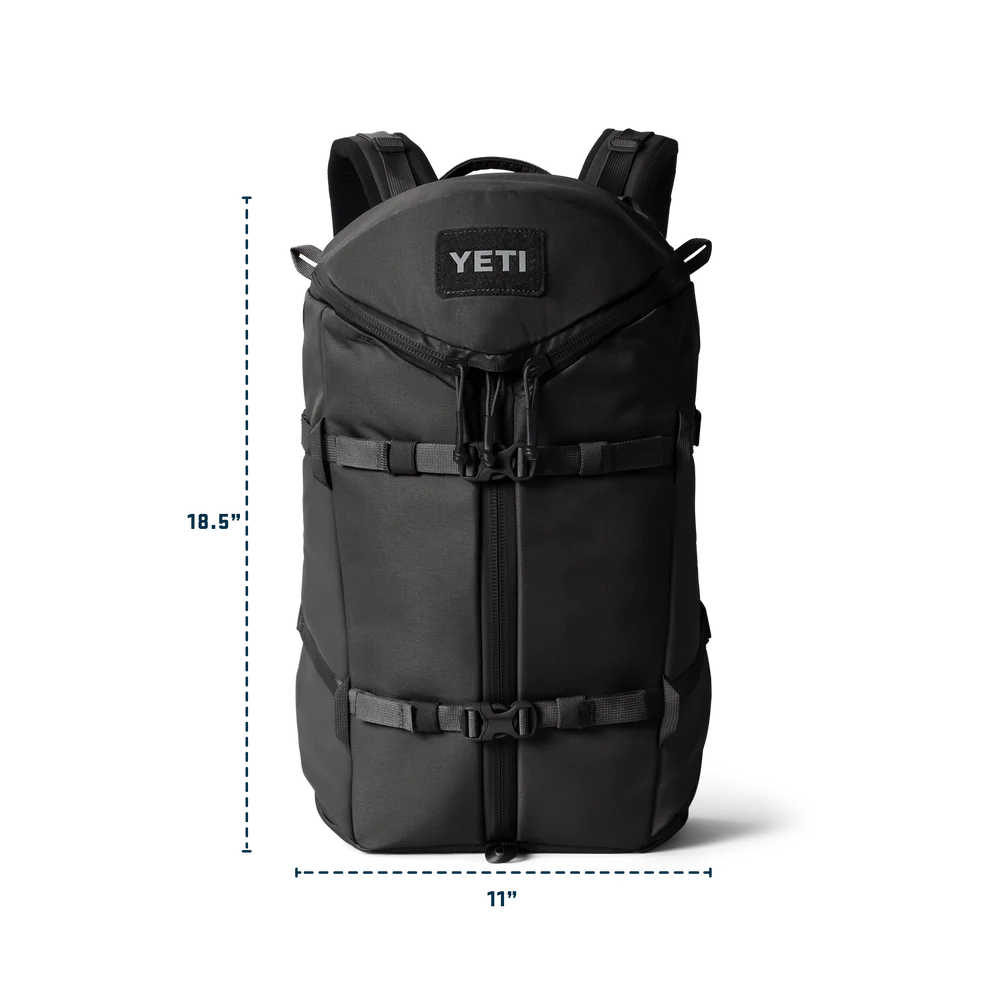 Black backpack with YETI logo and dimensions on a white background