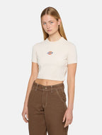 Woman wearing cream dickies t-shirt with a logo