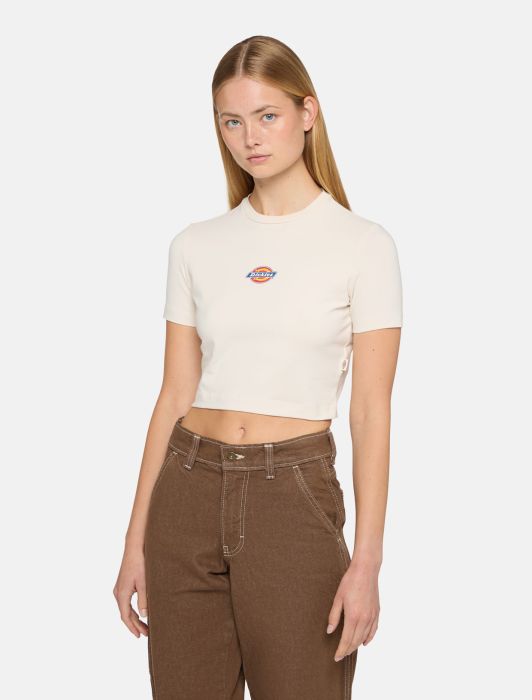 Woman wearing cream dickies t-shirt with a logo