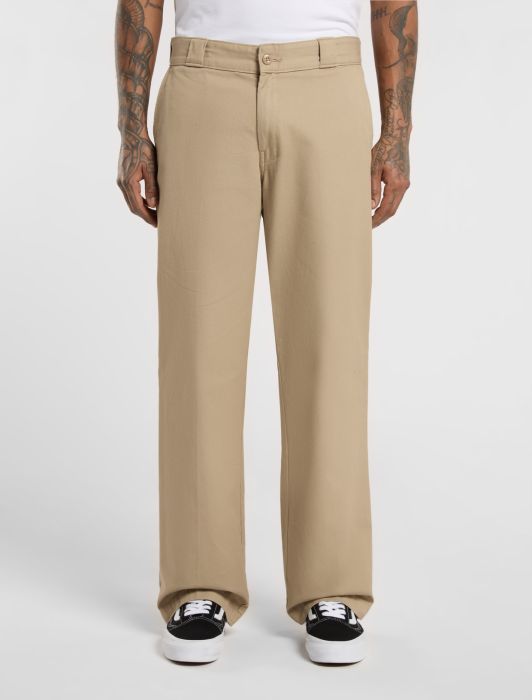 Dickies Beige work pants worn by a person on a white background