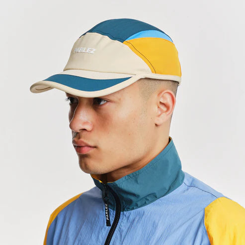 parlez venture cap yellow blue on model