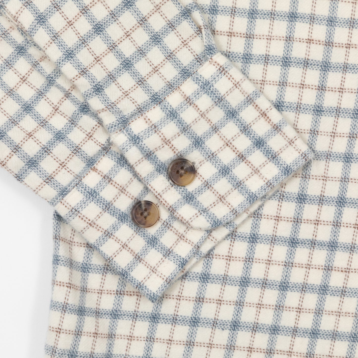 Close up of button cuffs on ble and cream brixton flannel