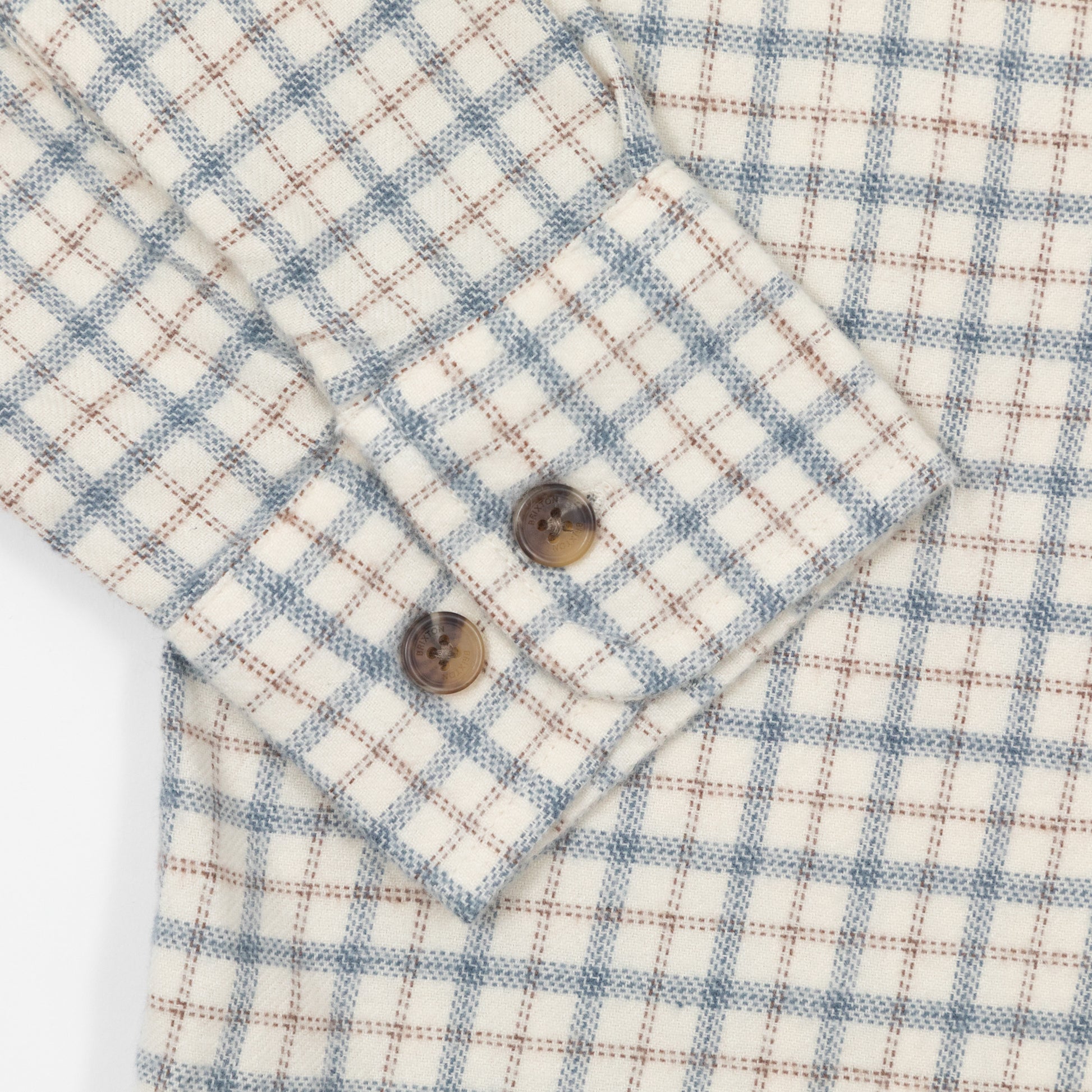 Close up of button cuffs on ble and cream brixton flannel