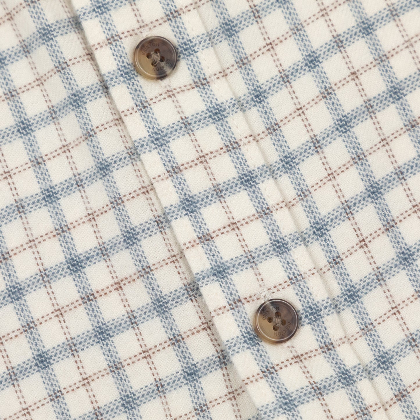 button and check close up on brixton check shirt