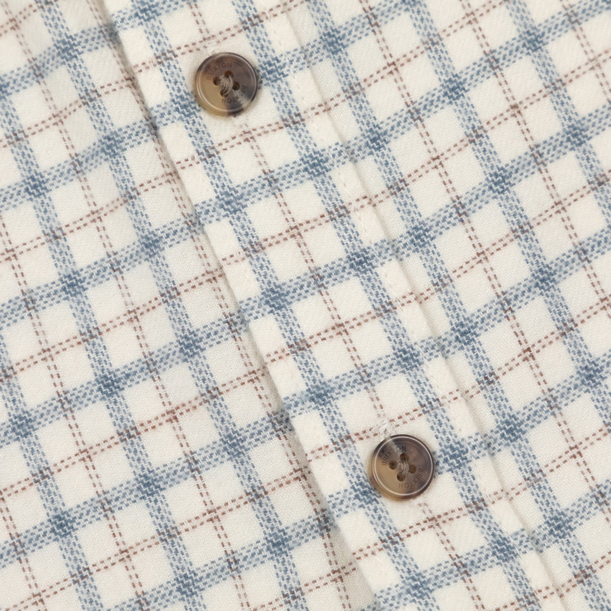 button and check close up on brixton check shirt