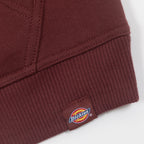 close-up of dickies logo tab on brown womens hoodie