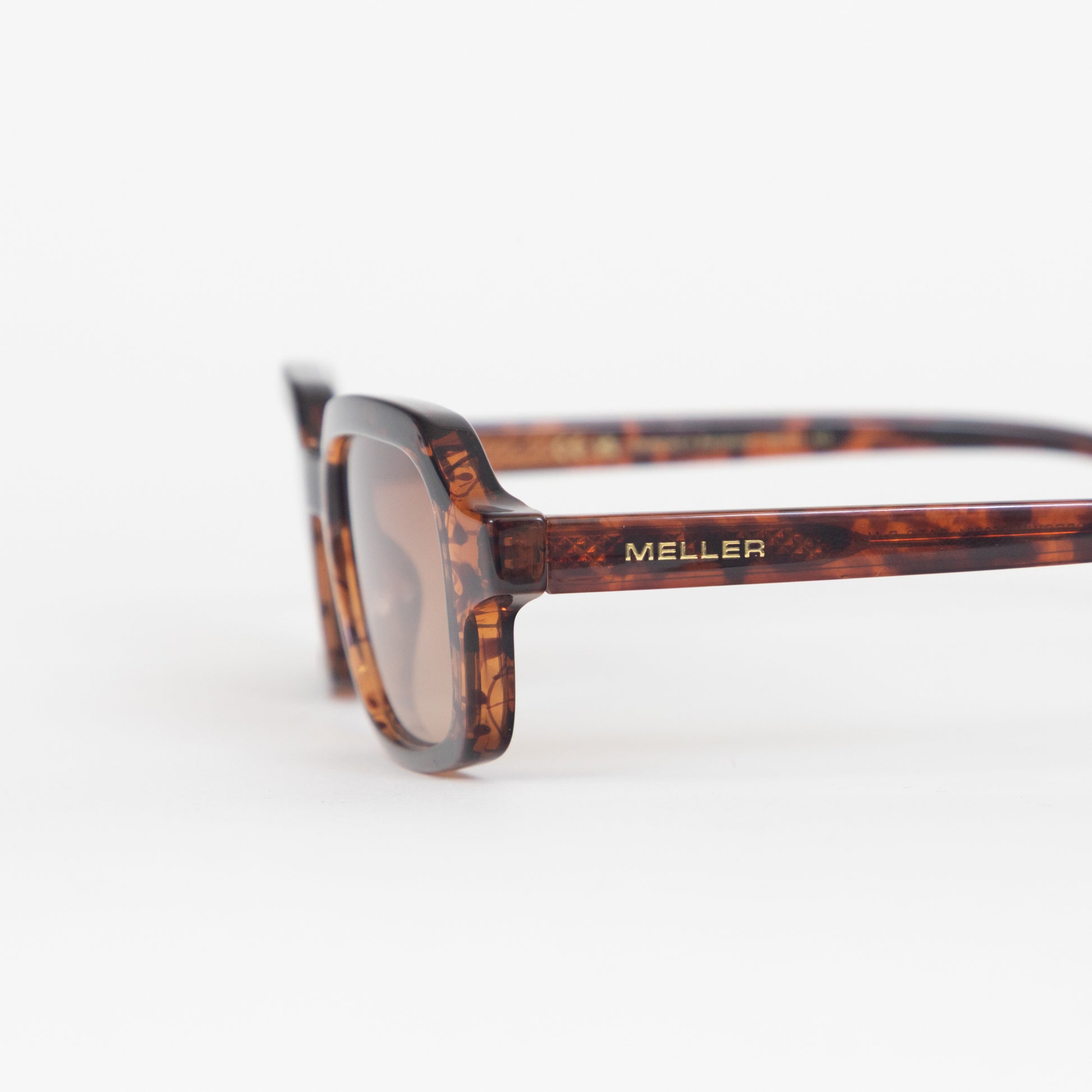 Meller sunglasses tortoiseshell frame and gold branding