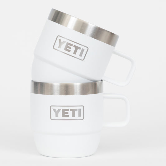 White YETI tumblers with silver insulation on a white background