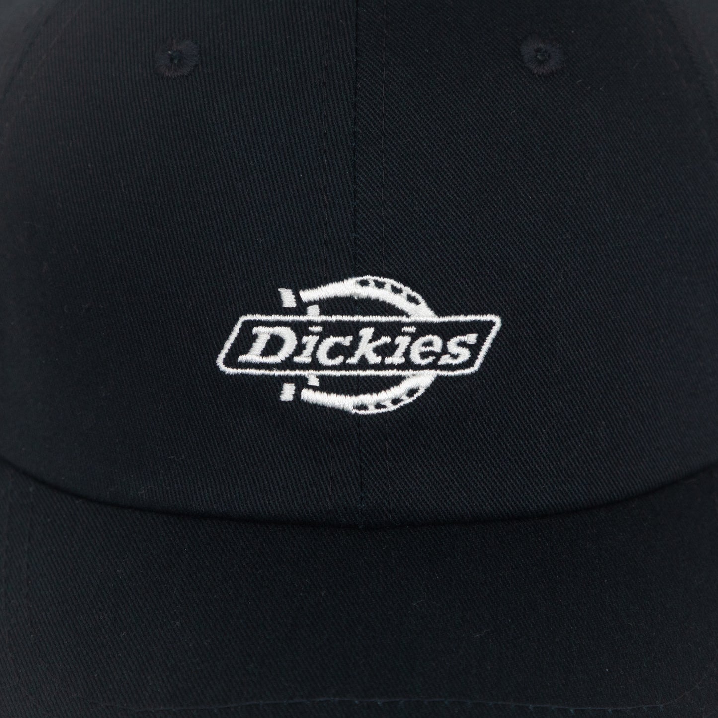 close-up of dickies logo on black cap
