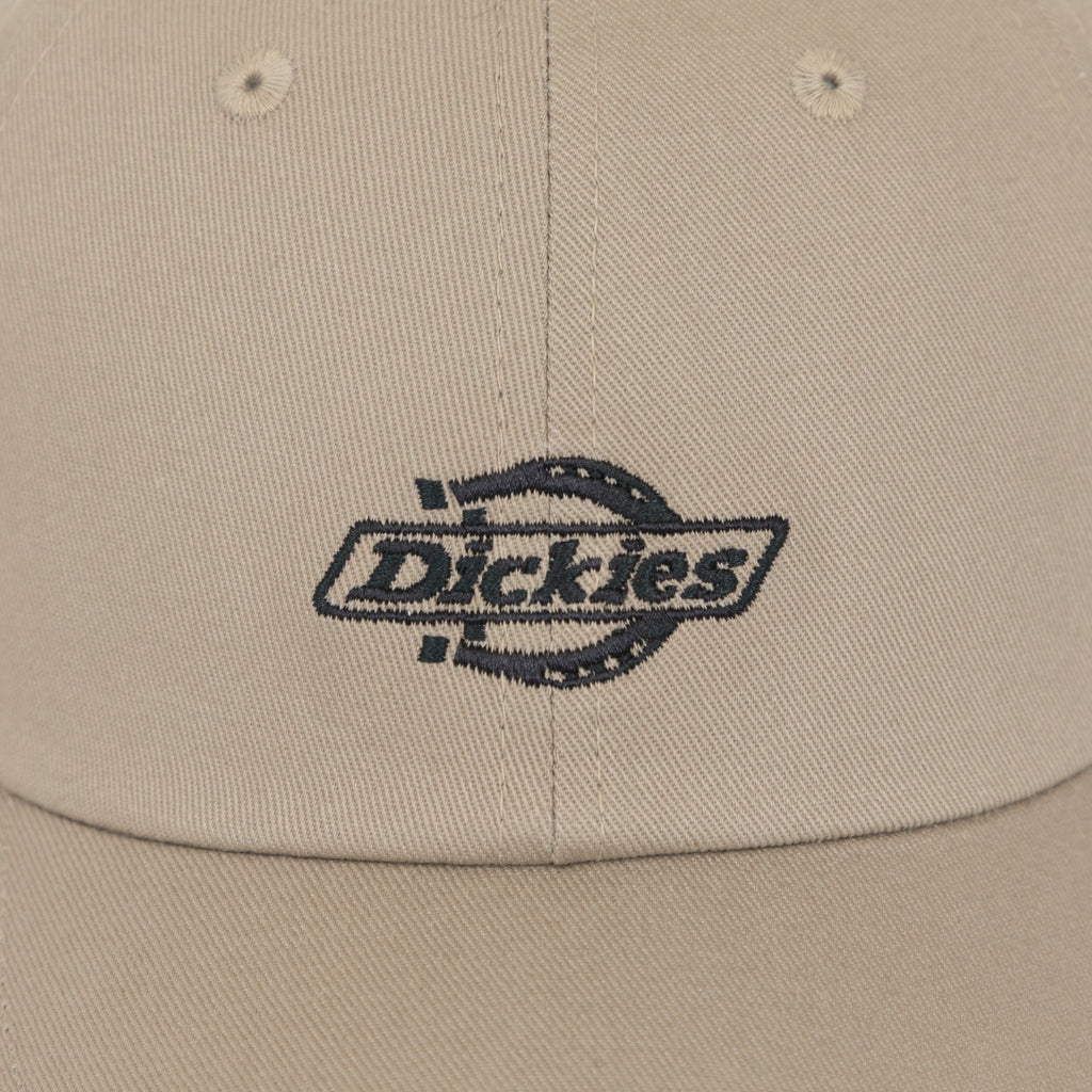 close-up of dickies logo on beige cap