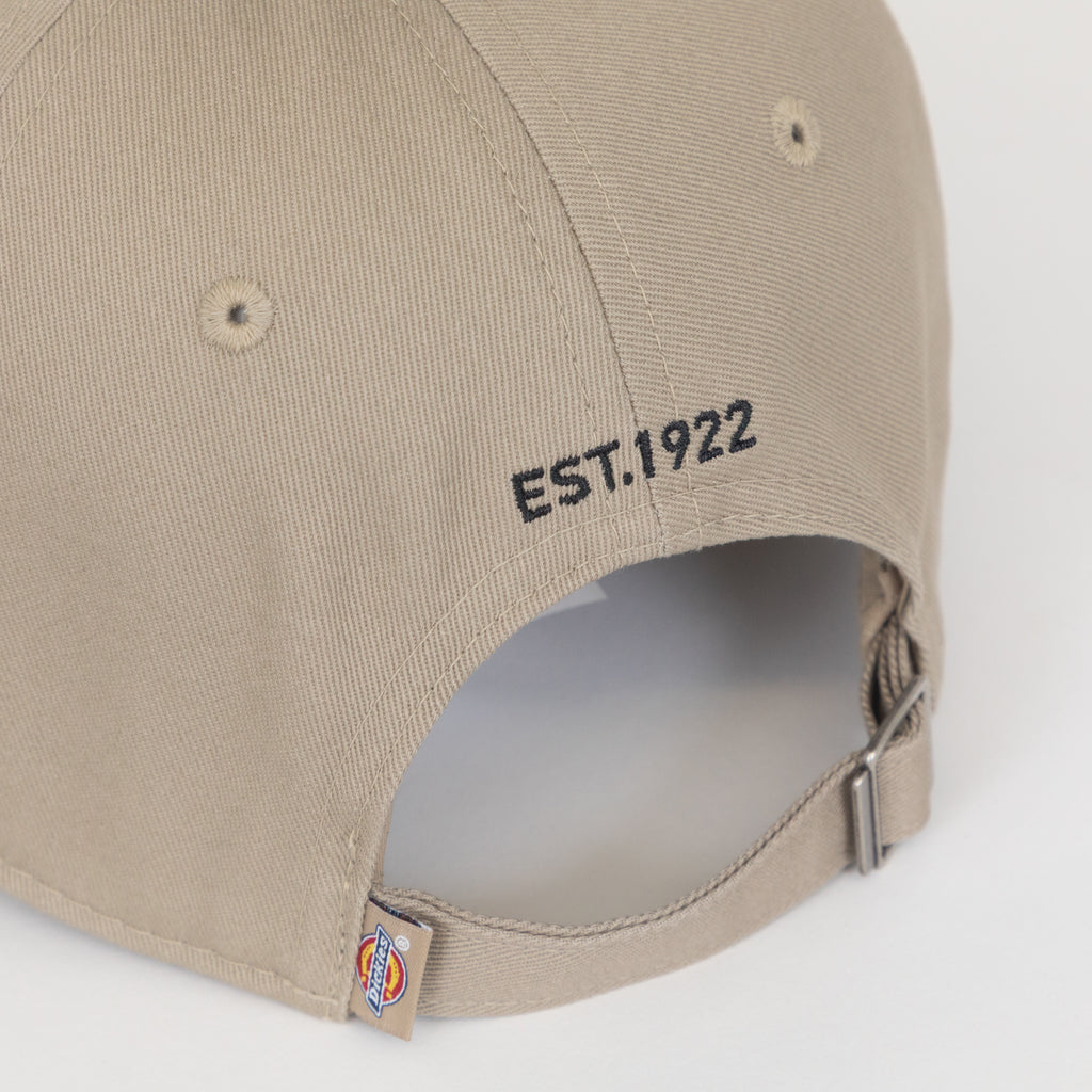adjustable closure on beige dickies cap
