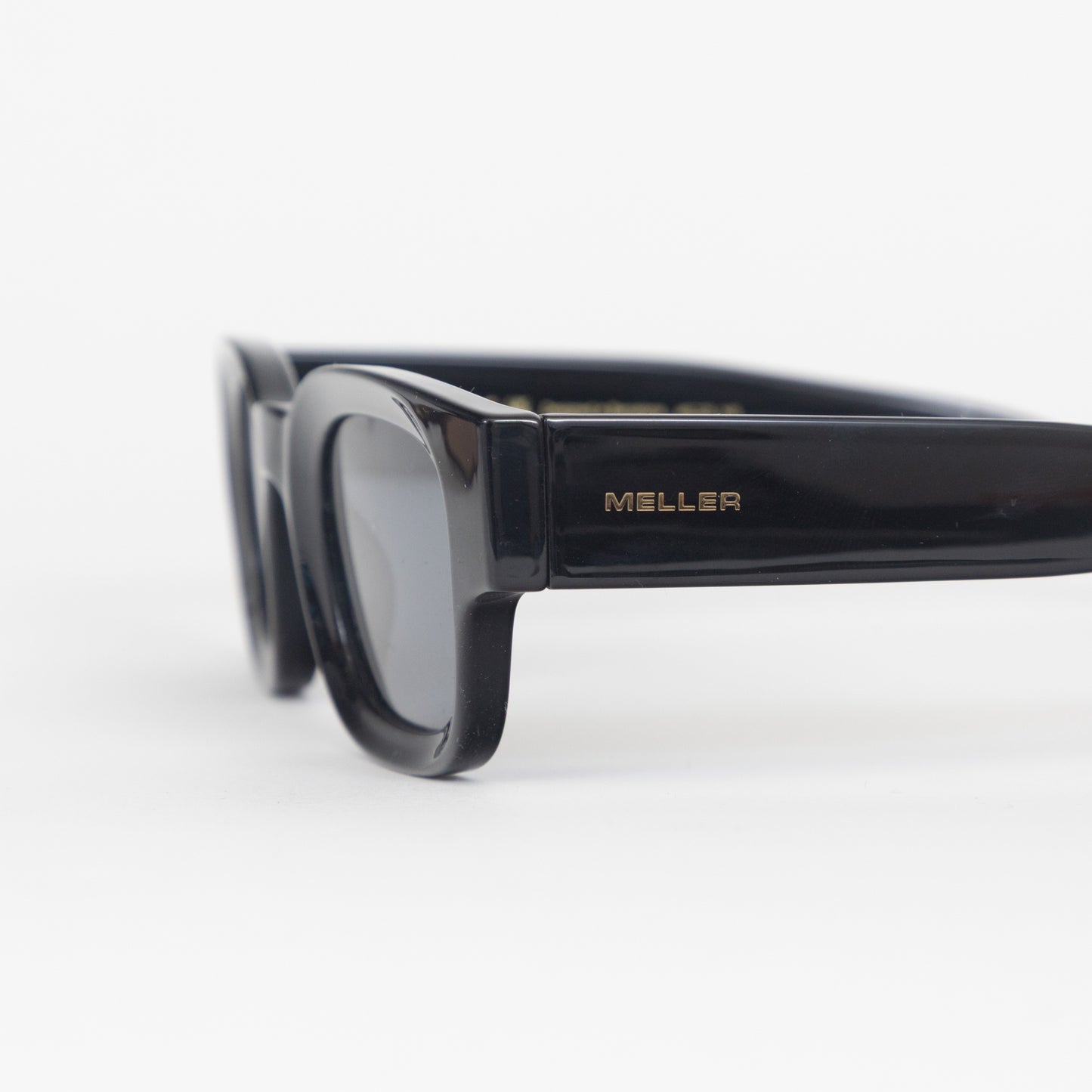 Black meller sunglasses with gold branding