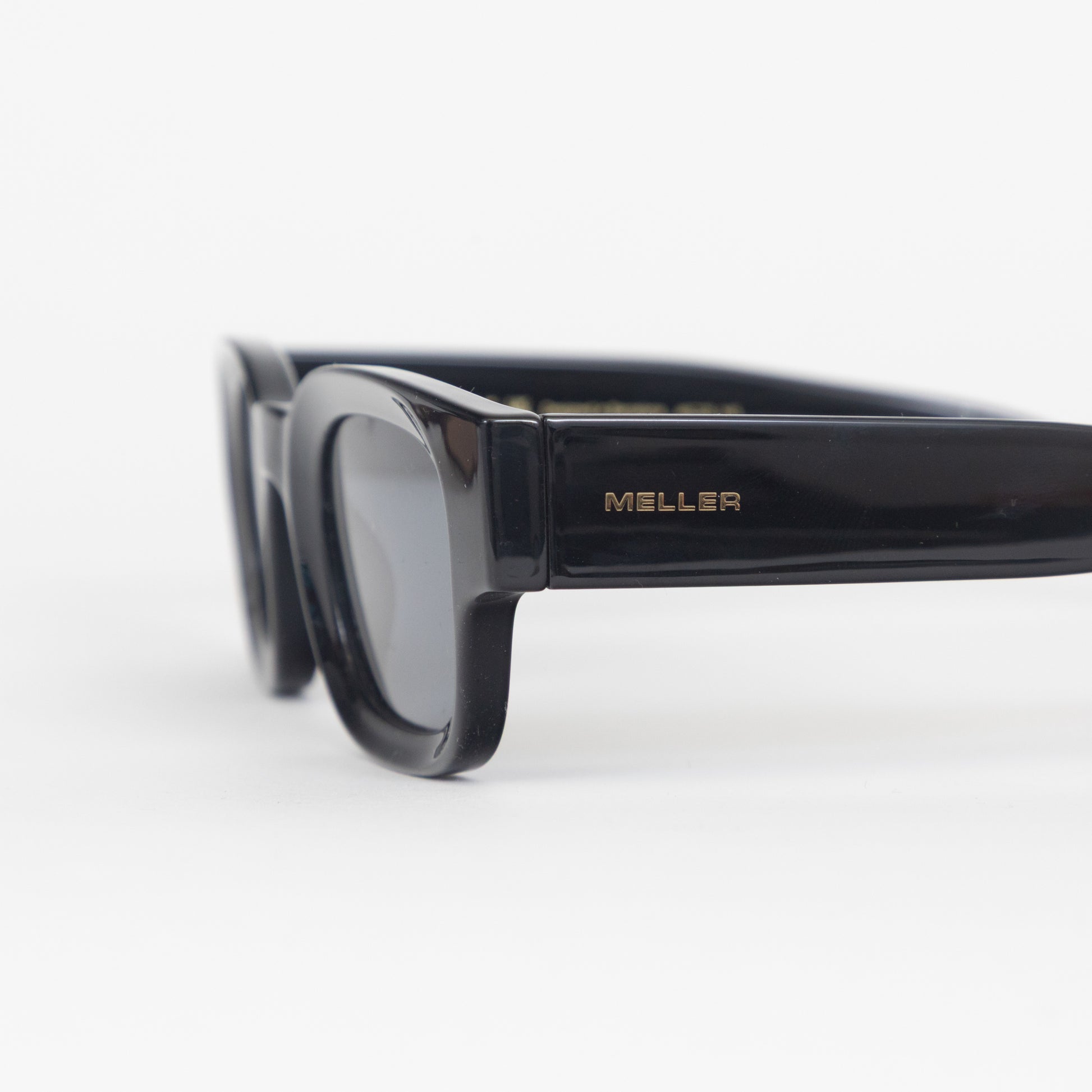 Black meller sunglasses with gold branding