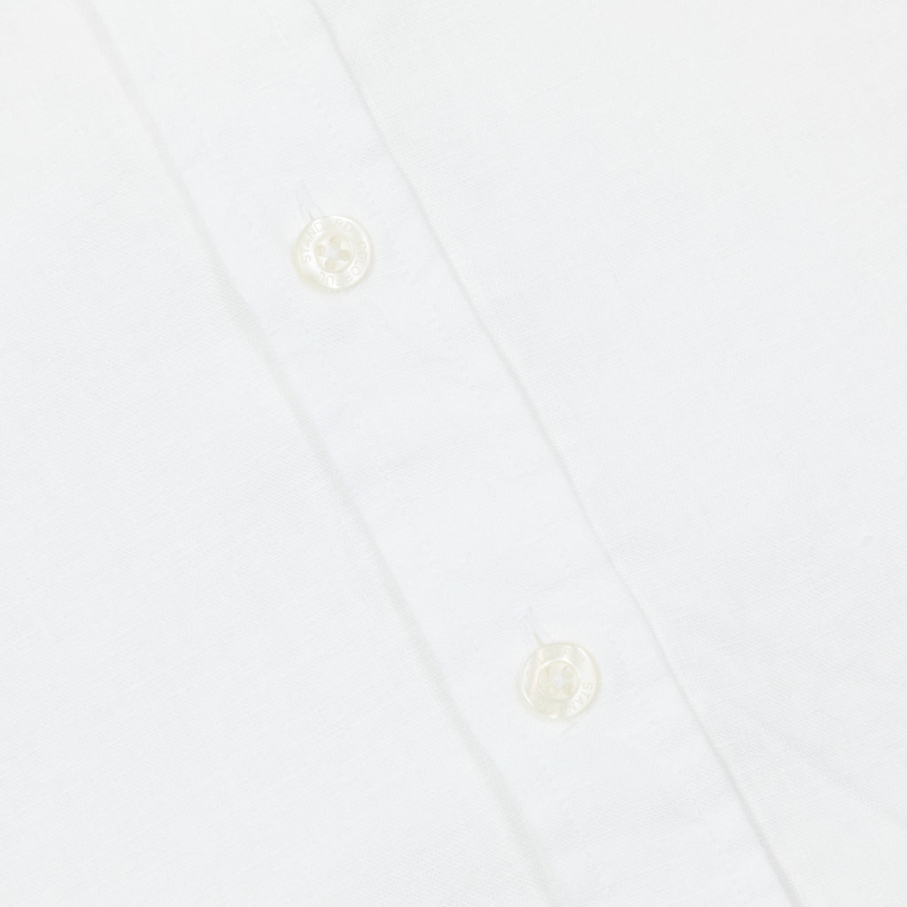 button up detail of colorful standard linen shirt