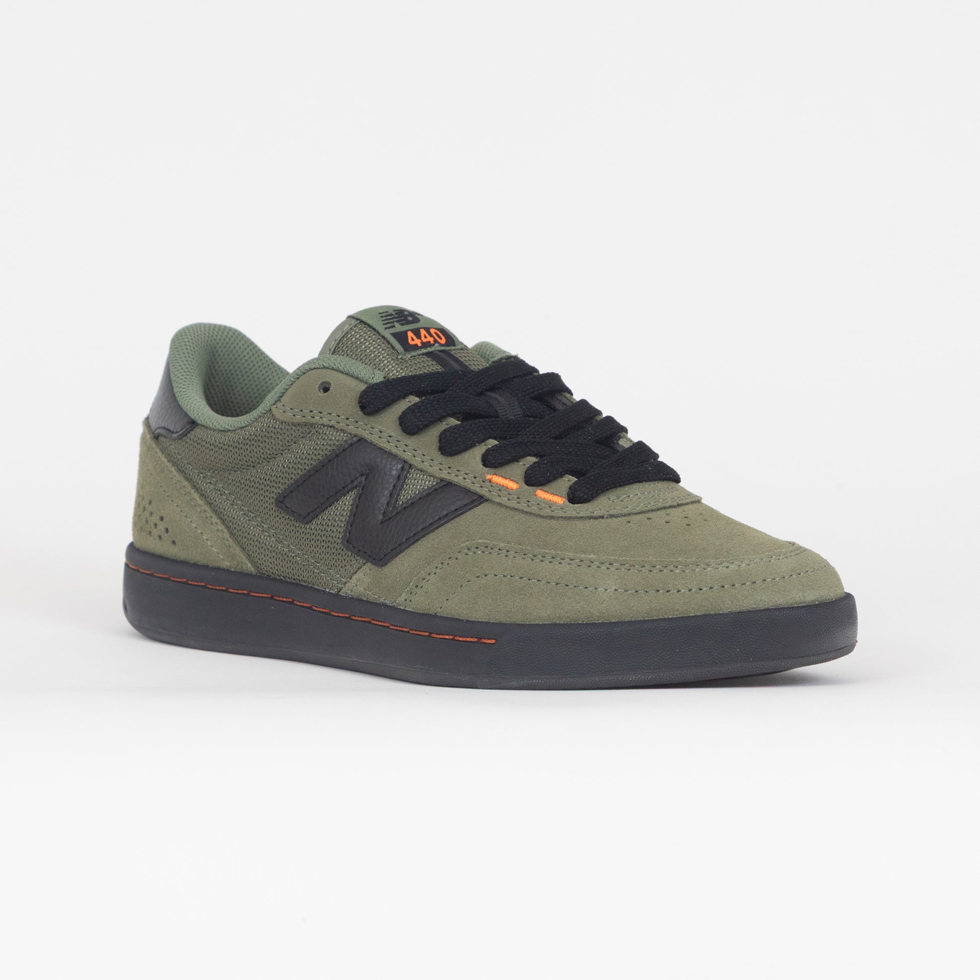 green new balance with black logo and laces
