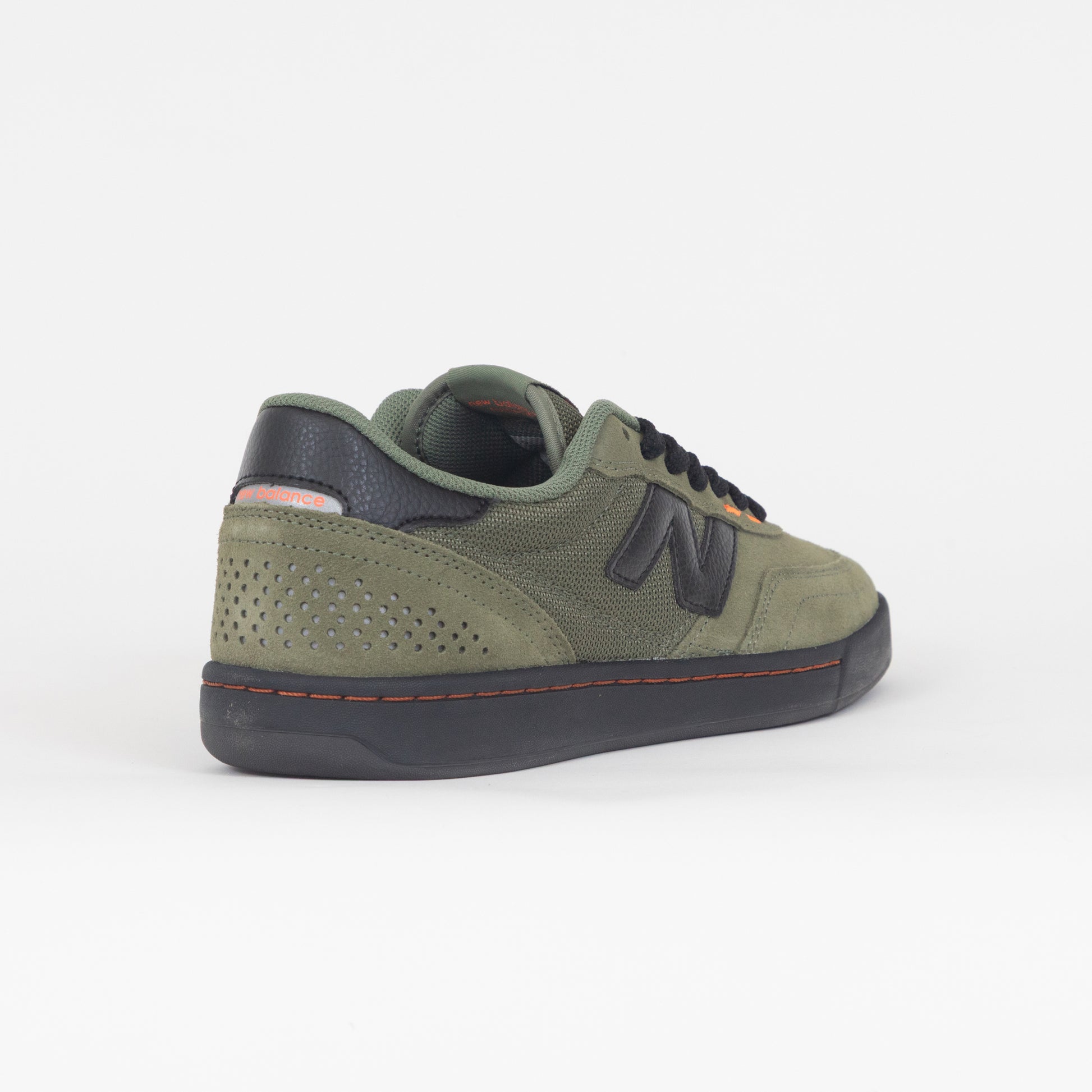 green new balance trainer with black gum and accents