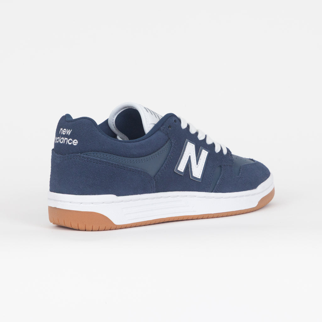 Navy blue new balance 480 trainer with white sole on a white background
