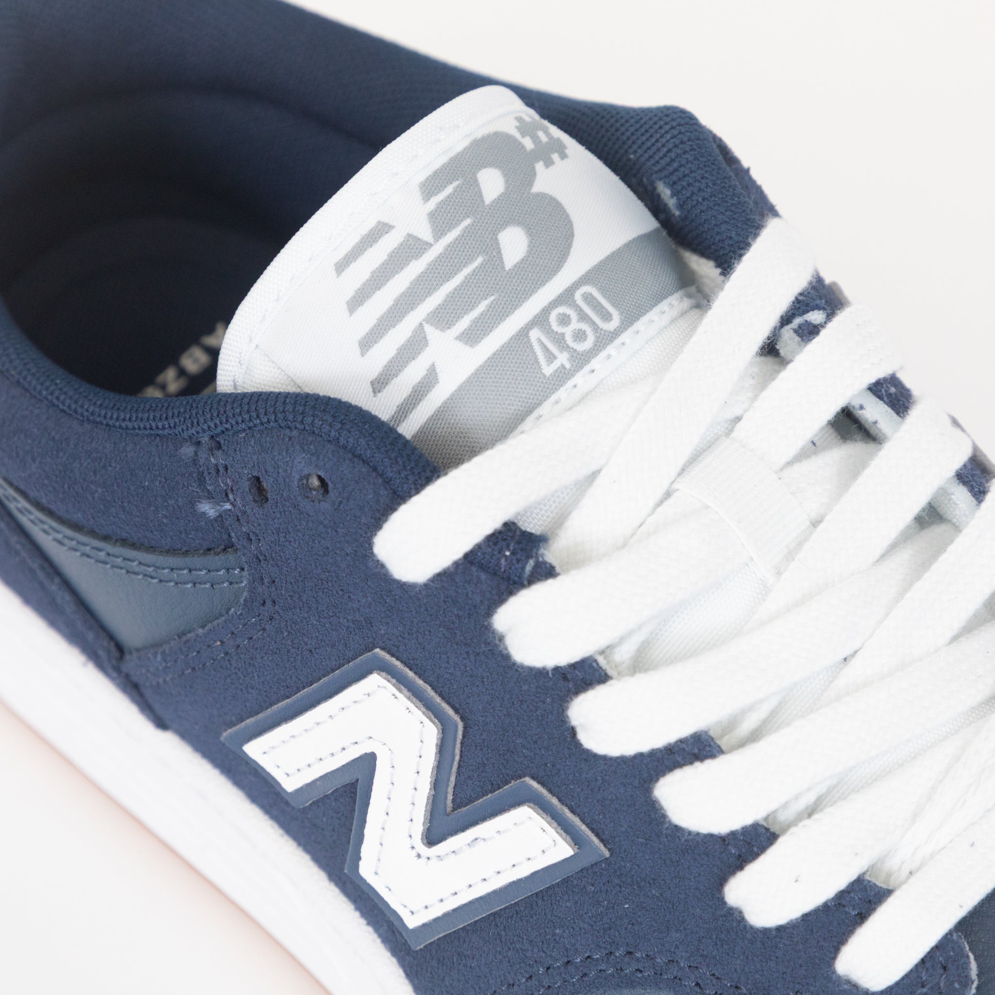 navy blue new balance trainer white white accents and laces