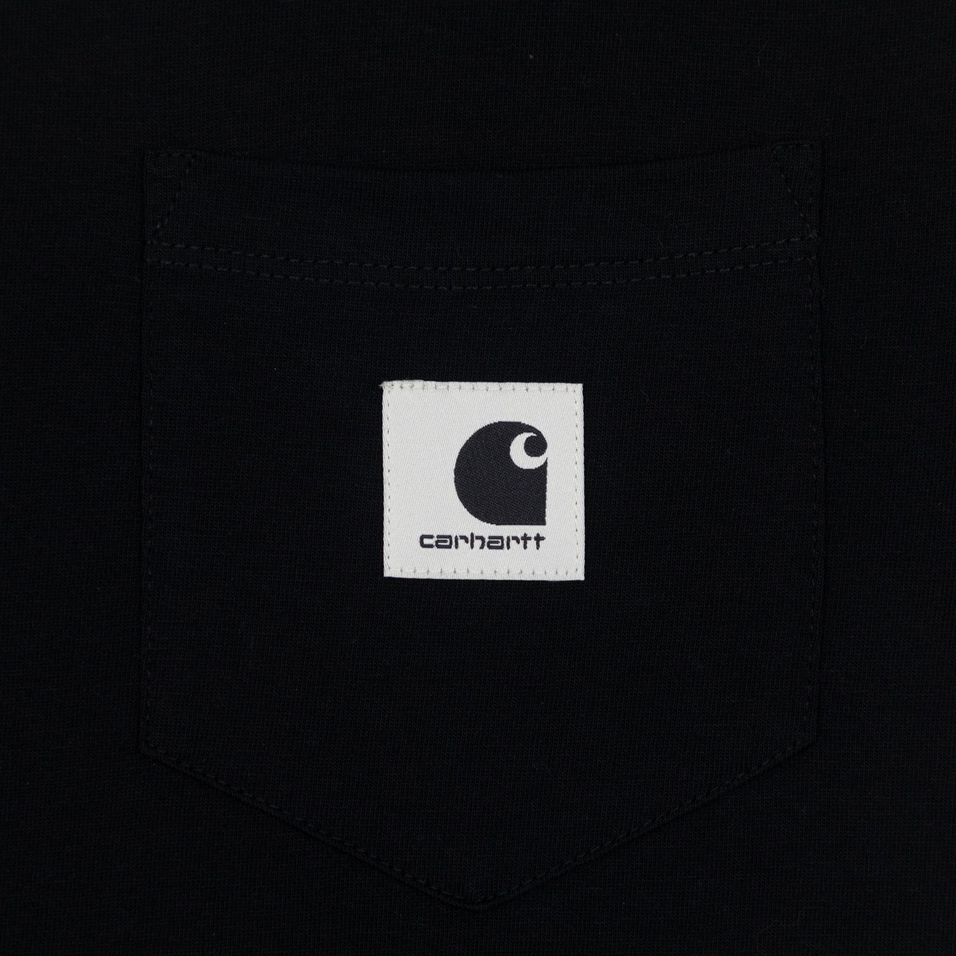 Close-up of a Carhartt logo on a black t-shirt