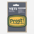 YETI patch with 'Prost!' text in packaging
