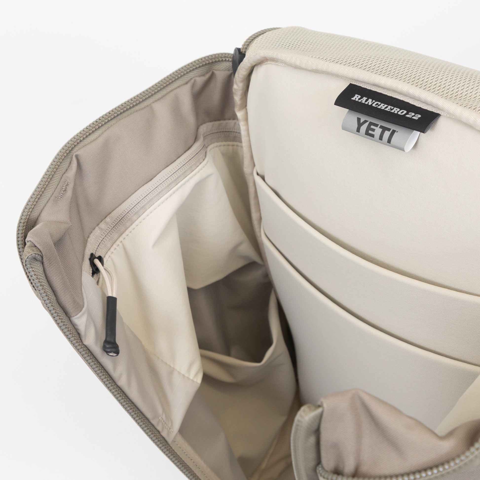 YETI beige backpack hidden pockets