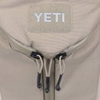 YETI beige backpack three zippers for easy access