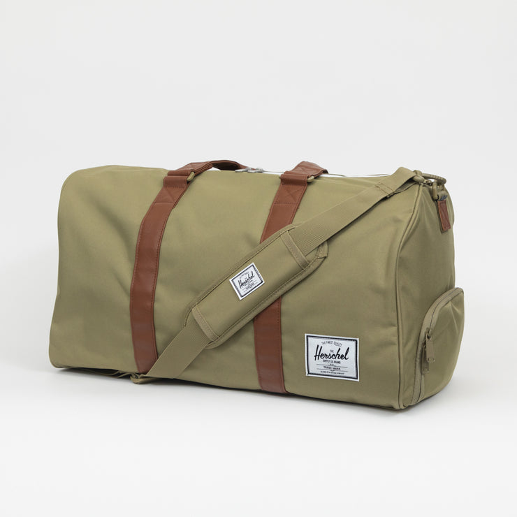 HERSCHEL SUPPLY CO. Novel Duffle Weekend Bag in DRIED HERB GREEN
